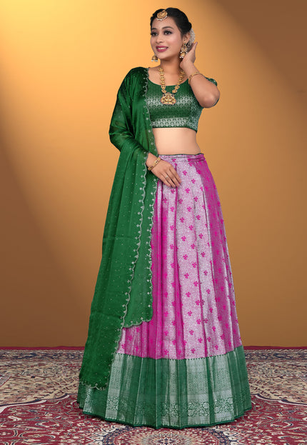Woman wearing a green and pink traditional outfit