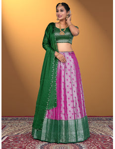 Woman wearing a green and pink traditional outfit