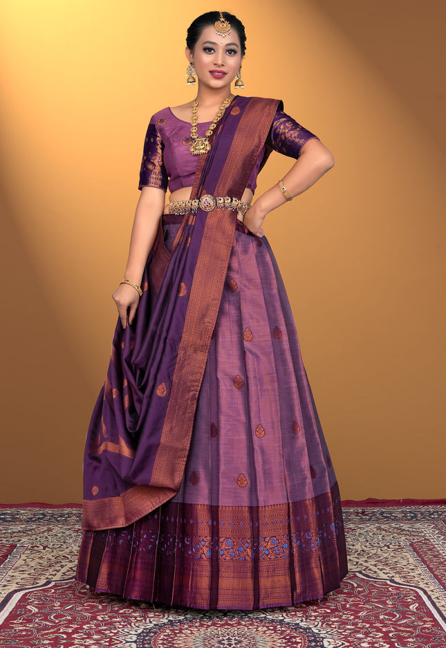 Woman wearing a traditional purple lehenga choli