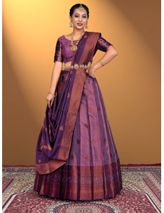 Woman wearing a traditional purple lehenga choli