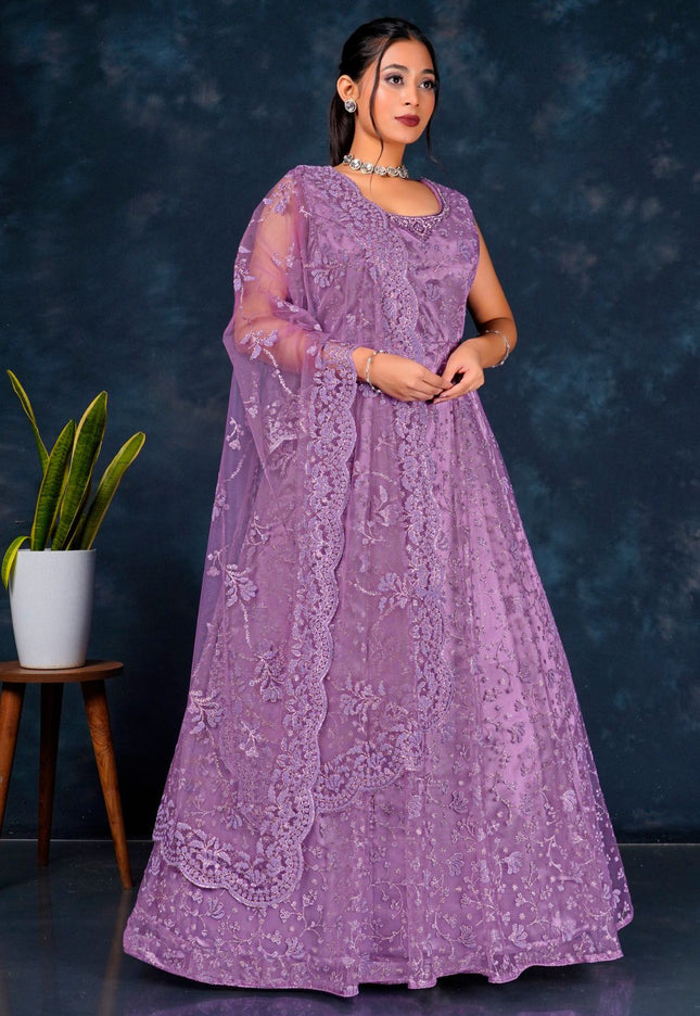 Woman wearing a purple embroidered dress Net Gown With Dupatta
