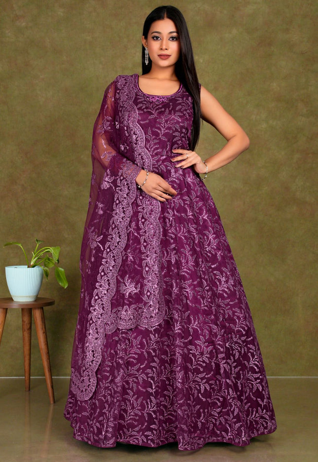 Woman wearing a purple-coloured party wear net gown for women