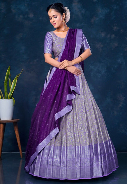 Woman wearing a purple lehenga choli with dupatta