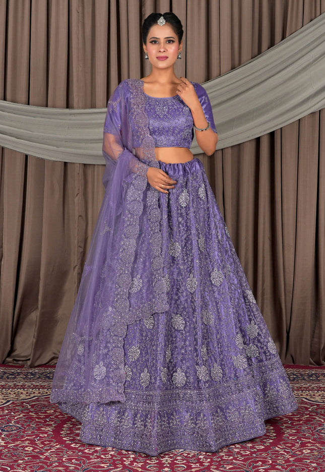 Woman wearing a purple embroidered traditional outfit