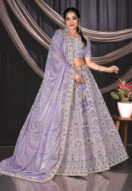 Woman in a traditional lavender outfit with a patterned design