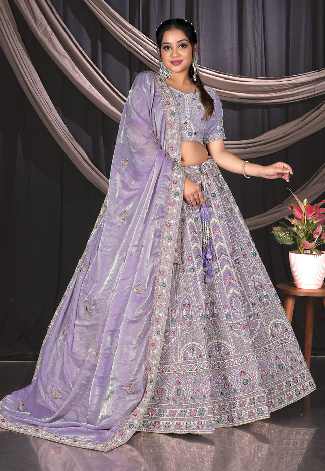 Woman in a traditional lavender outfit with a patterned design