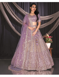 Woman in a purple embroidered traditional outfit