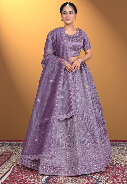 Woman wearing a purple embroidered traditional outfit