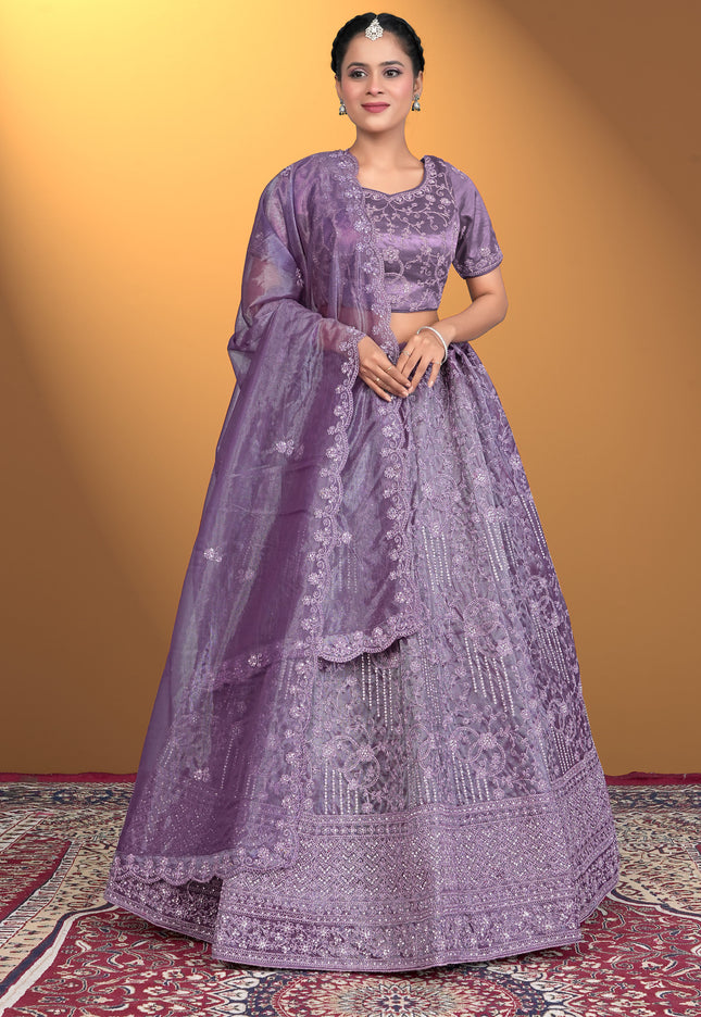 Woman wearing a purple embroidered traditional outfit
