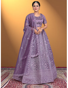 Woman wearing a purple embroidered traditional outfit