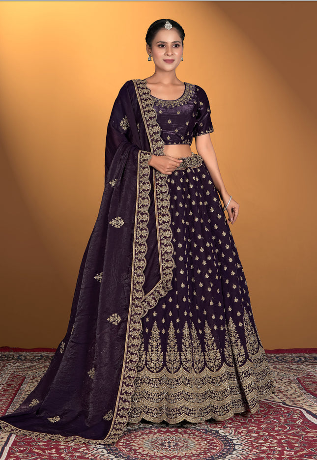 Woman wearing a dark purple embroidered traditional outfit