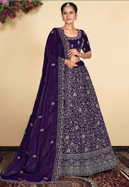 Woman wearing a traditional purple and silver embroidered outfit