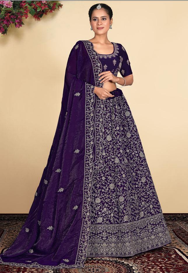 Woman wearing a traditional purple and silver embroidered outfit