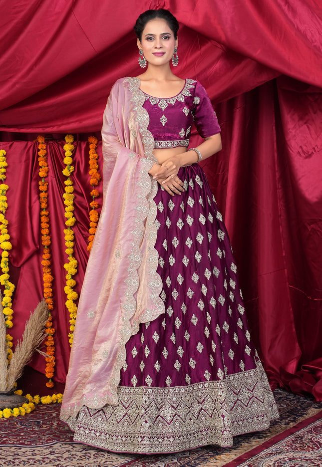 Woman in a traditional purple and pink lehenga choli