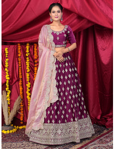 Woman in a traditional purple and pink lehenga choli