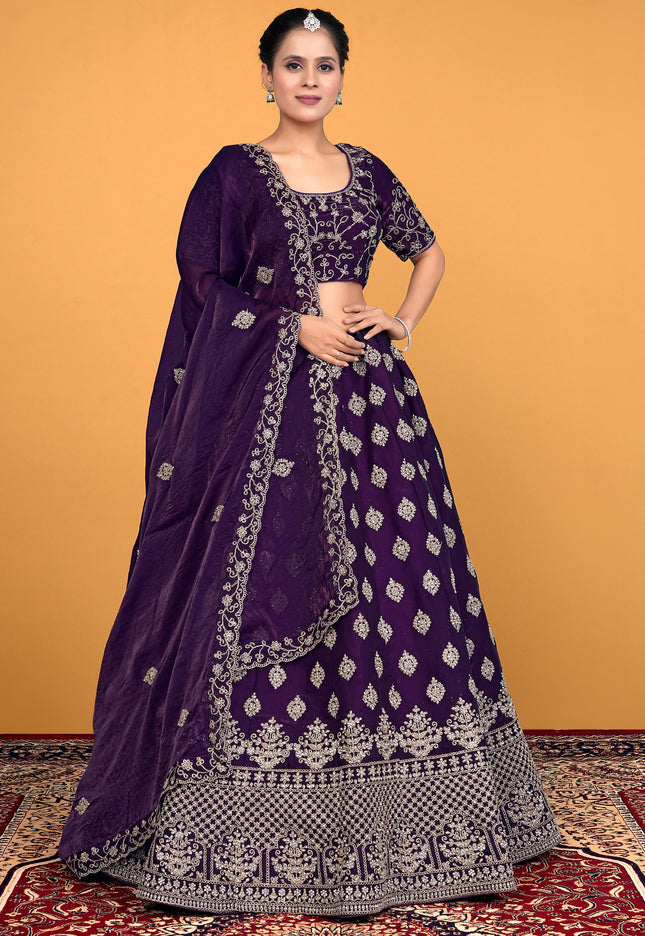 Woman wearing a purple embroidered lehenga choli