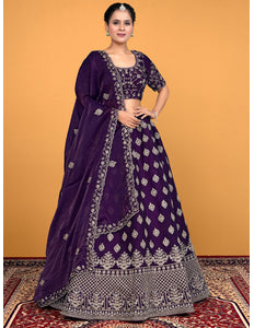 Woman wearing a purple embroidered lehenga choli