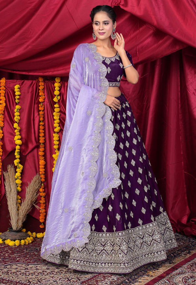 Woman in a traditional outfit with a purple lehenga choli