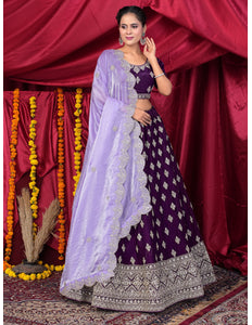 Woman in a traditional outfit with a purple lehenga choli