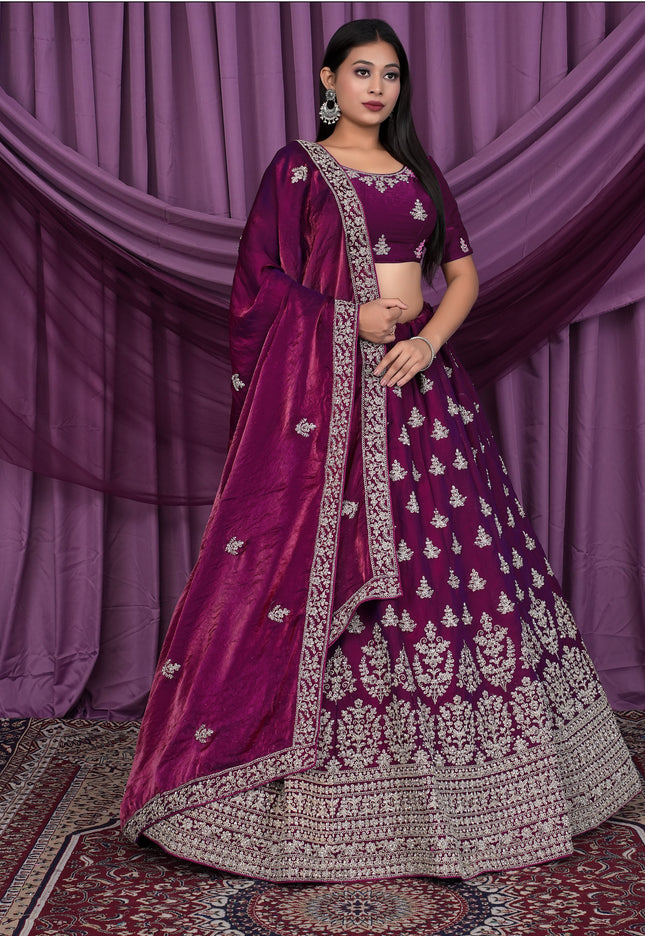 Woman wearing a traditional purple and silver embroidered outfit