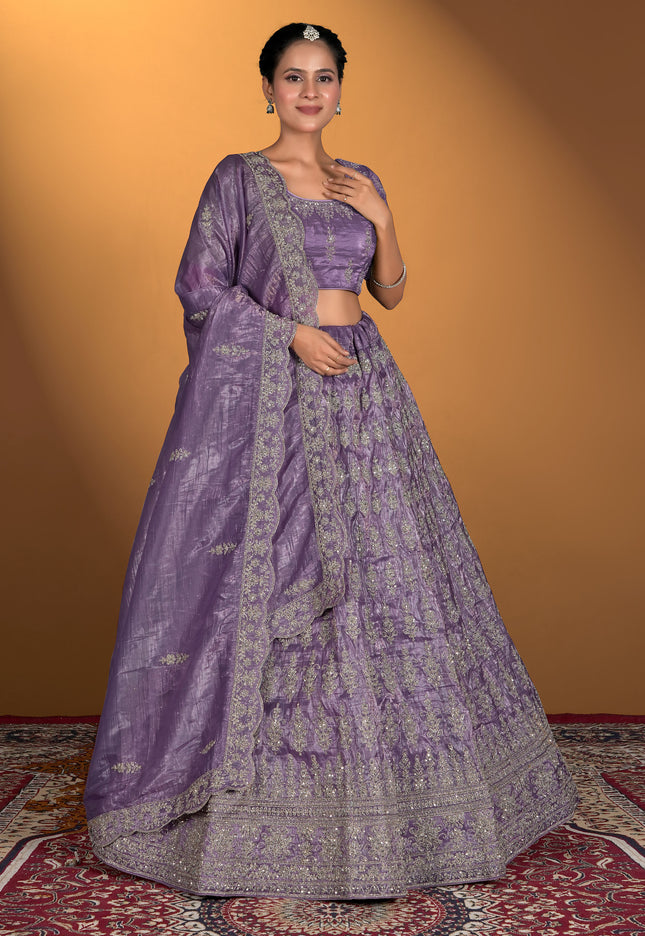 Woman wearing a traditional purple lehenga