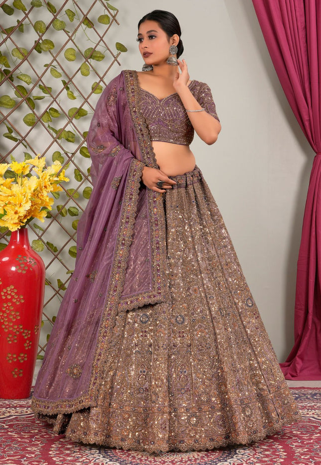 Woman in traditional outfit with purple dupatta