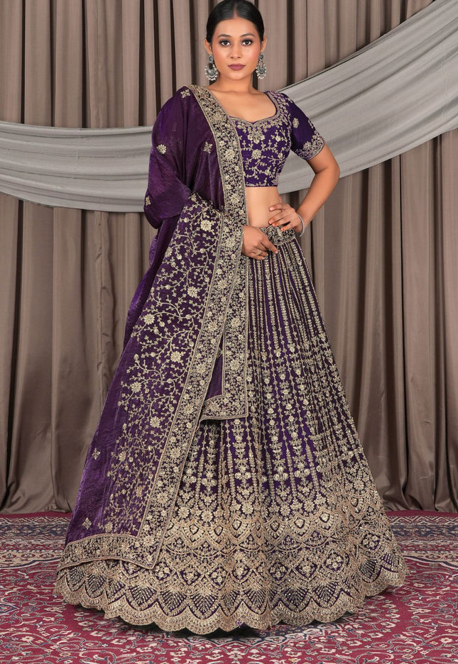Woman wearing a traditional purple and gold embroidered outfit