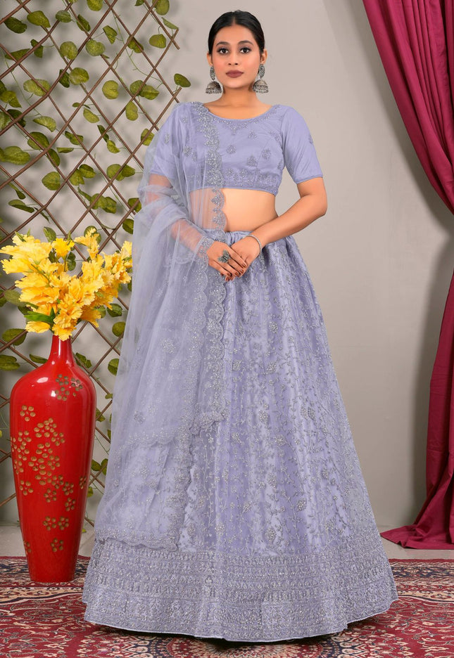 Woman in a light blue traditional lehenga choli with matching dupatta
