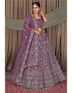 Woman in a traditional purple embroidered outfit