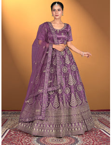 Woman wearing a purple embroidered traditional outfit