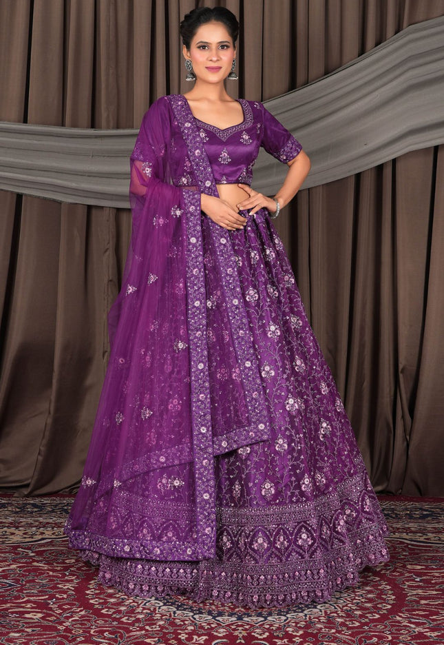 Woman wearing a purple embroidered traditional lehenga choli
