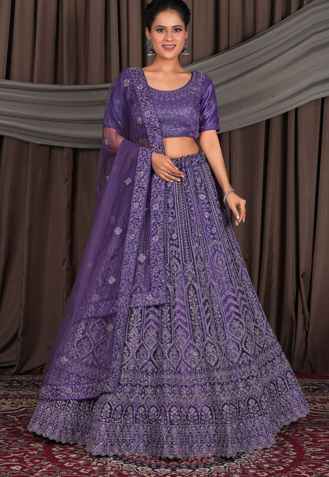 Woman wearing a purple embroidered traditional outfit against