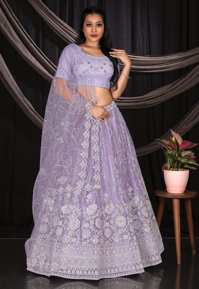 Woman in a Purple embroidered traditional lehenga choli outfit