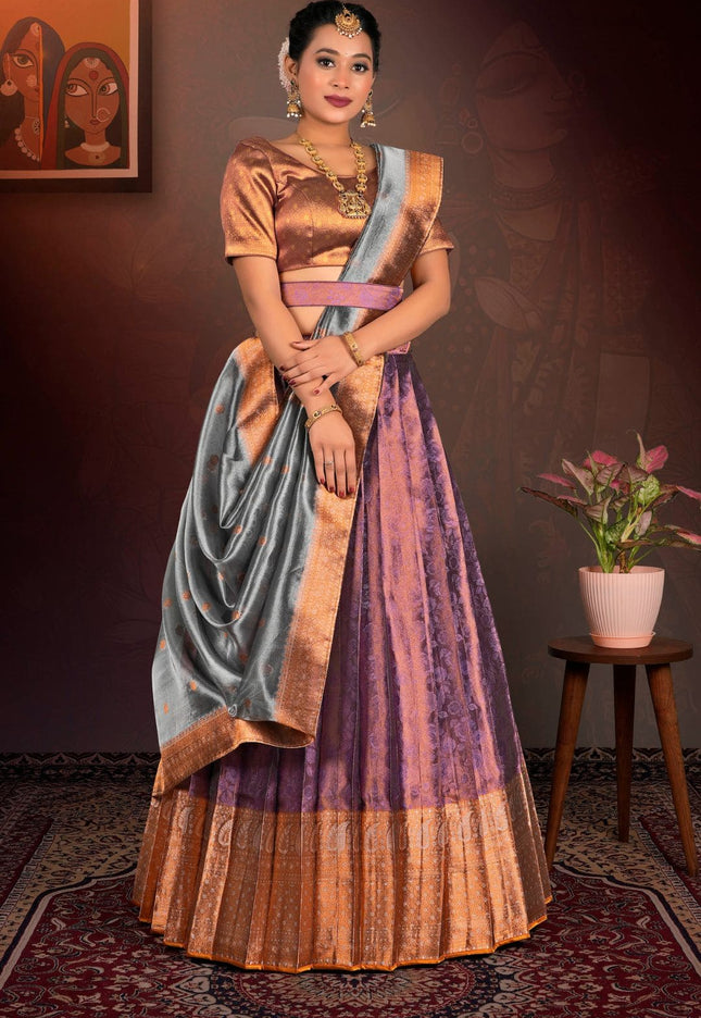 Woman in traditional purple lehenga choli with dupatta