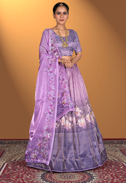 Woman wearing a purple lehenga choli with floral patterns