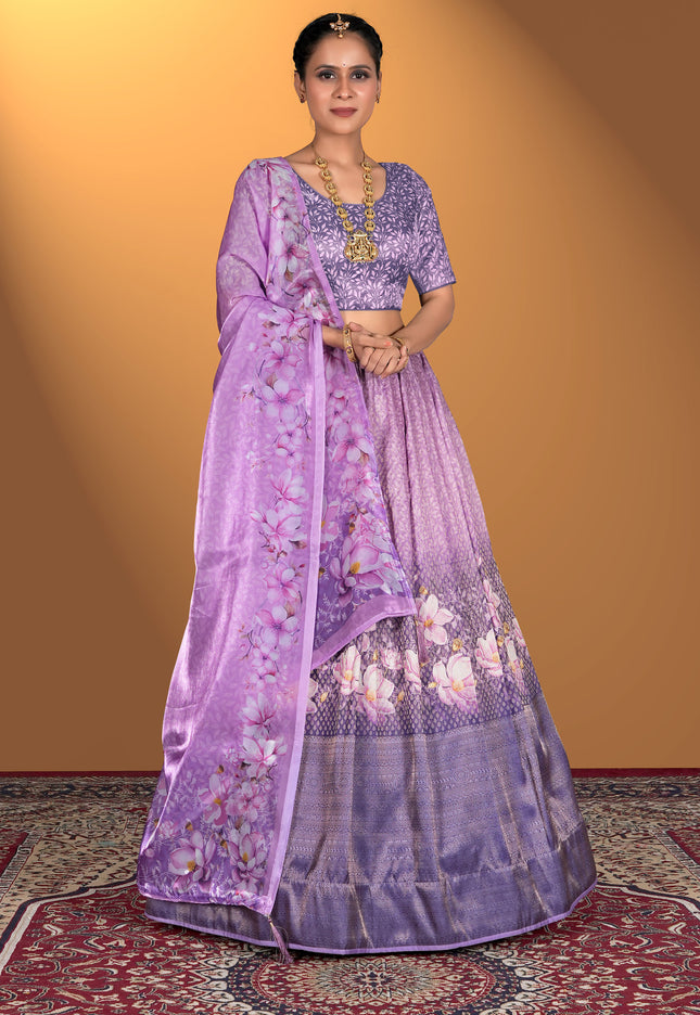 Woman wearing a purple lehenga choli with floral patterns