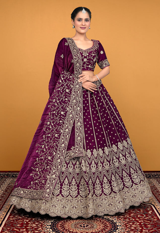 Woman wearing a purple embroidered traditional lehenga choli