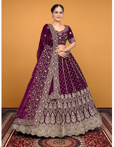 Woman wearing a purple embroidered traditional lehenga choli