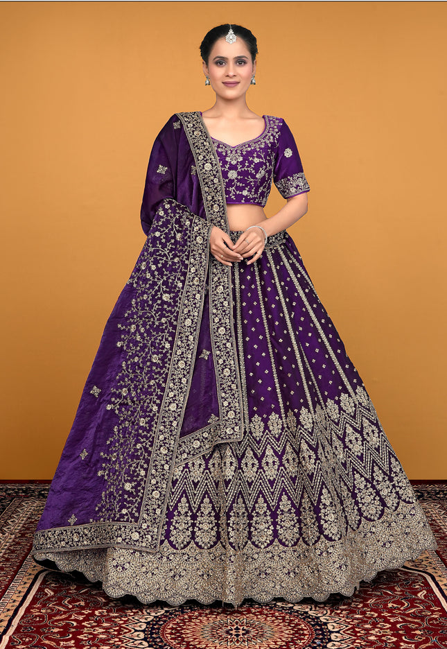 Woman wearing a purple embroidered lehenga choli
