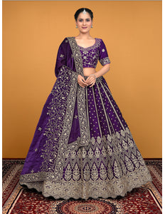 Woman wearing a purple embroidered lehenga choli