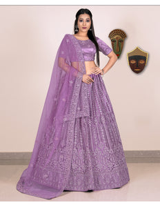 Woman wearing a purple embroidered lehenga