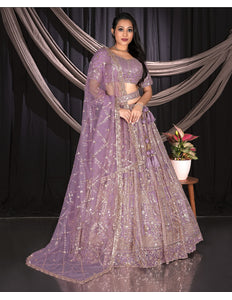 Woman in a purple embroidered traditional outfit