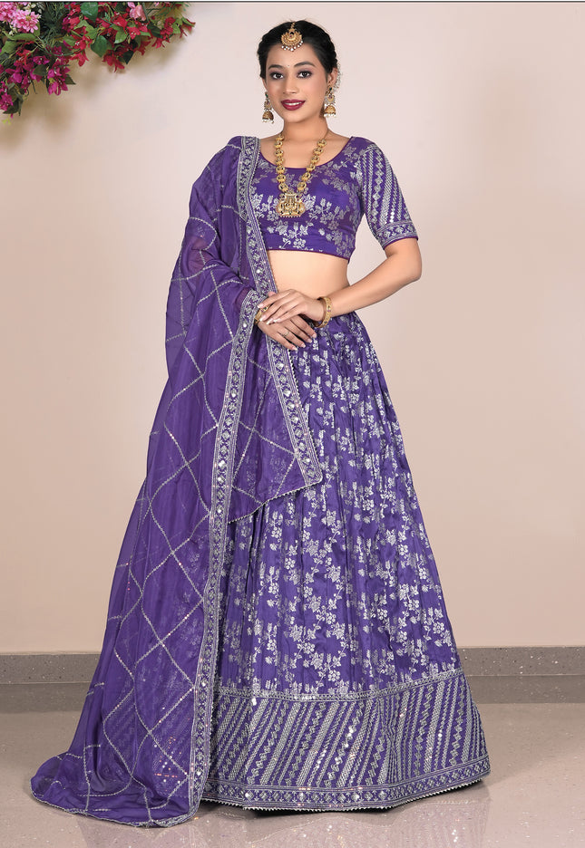 Woman wearing a purple embroidered lehenga choli