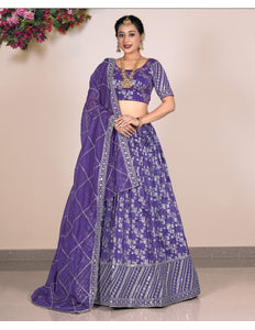 Woman wearing a purple embroidered lehenga choli