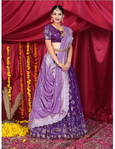 Woman in a purple traditional lehenga choli