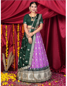 Woman in a green and purple traditional lehenga choli