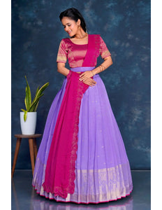 Woman wearing a pink and purple traditional lehenga choli with dupatta