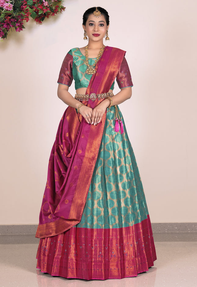 Woman wearing a traditional lehenga with a green and pink pattern
