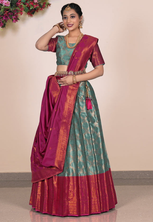 Woman wearing a traditional lehenga with a green and red pattern