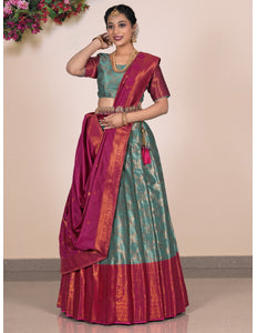 Woman wearing a traditional lehenga with a green and red pattern